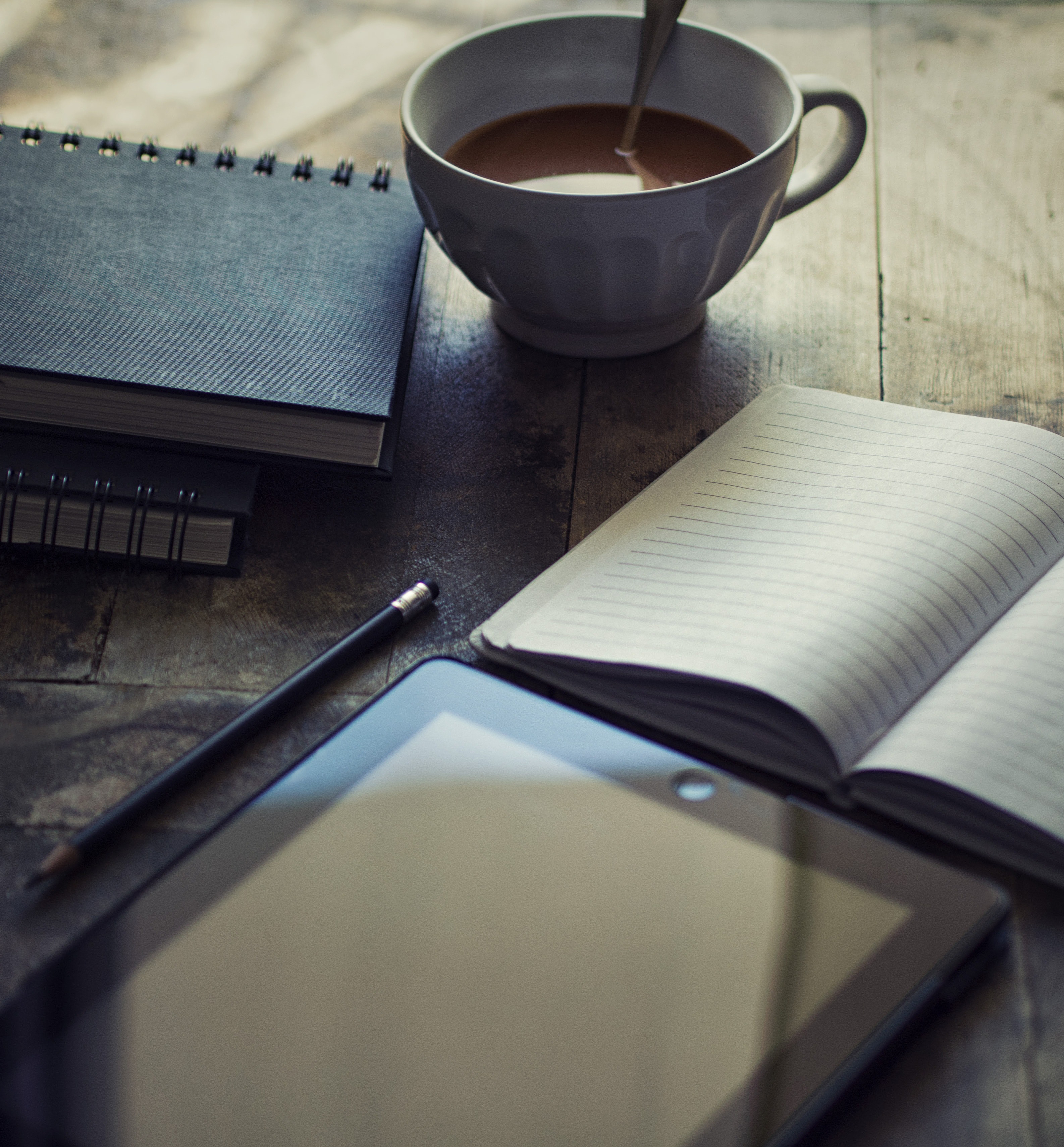  coffee with notebooks and tablet